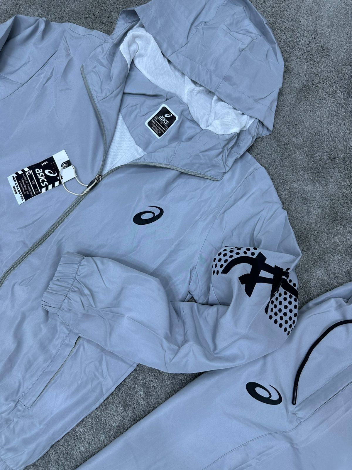 Chandal Asics *reflectante* gris